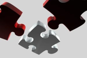 Two red puzzle pieces being compared