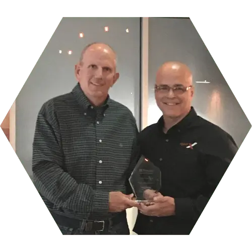 Craig Hysong presenting a 2022 Dorain Award Trophy