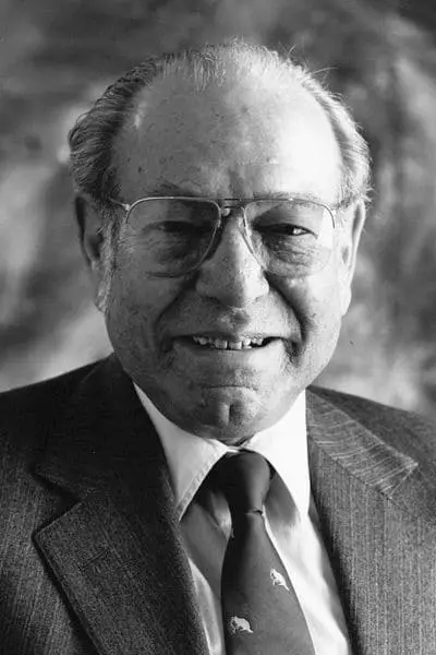 Dorain Shainin smiling for a photo in black and white
