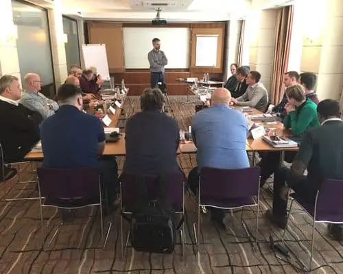 Shainin consultant conducting Red X training for customers in a meeting space