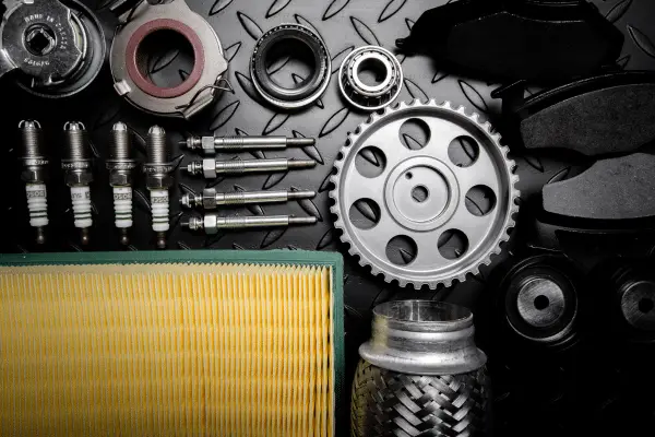Multiple mechanical components neatly displayed on a diamond plate table